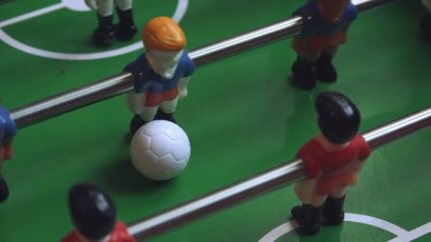 Table soccer player kicking the football — Stock Video