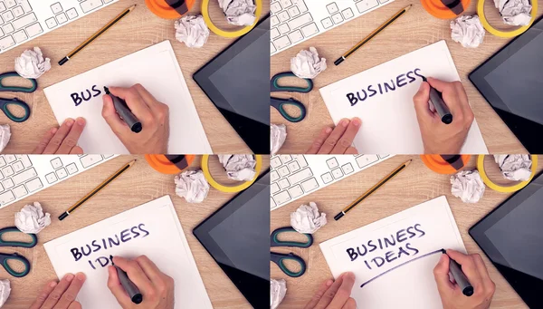 Бизнес-идеи, бизнесмен пишет идеи на бумаге — стоковое фото