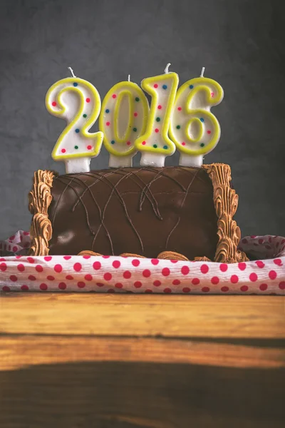 Retro toned Christmas and New Year chocolate cake — Stock Photo, Image