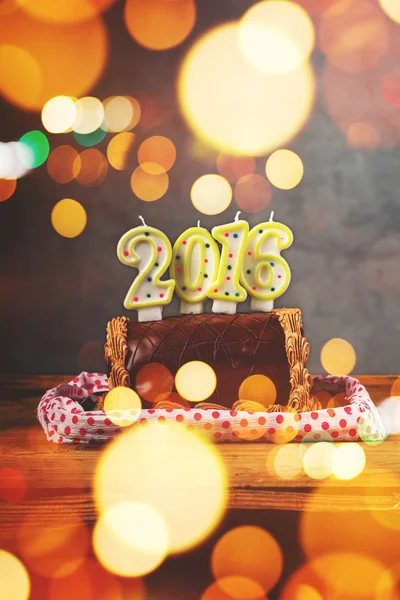 Retro toned Christmas and New Year chocolate cake — Stock Photo, Image