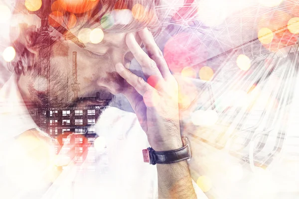 Double exposure portrait of worried male architect — Stockfoto