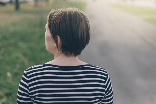 Casual woman walking down the street — Stok fotoğraf