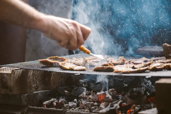 Grilling pork meat chops on barbecue — Stock Photo, Image