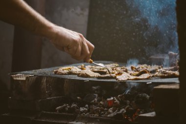 Grilling pork meat chops on barbecue