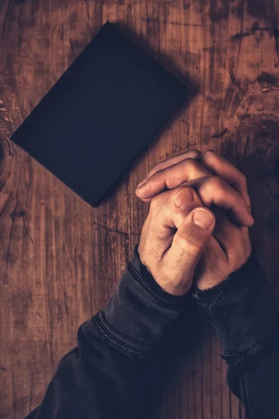 Folded hands of Christian man praying — Stock Photo, Image