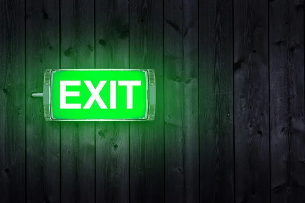 Illuminated green exit sign — Stock Photo, Image