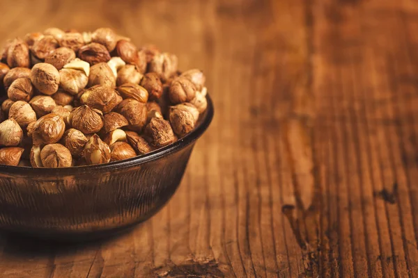 Plenty of ripe hazelnuts in bowl — Stock Photo, Image