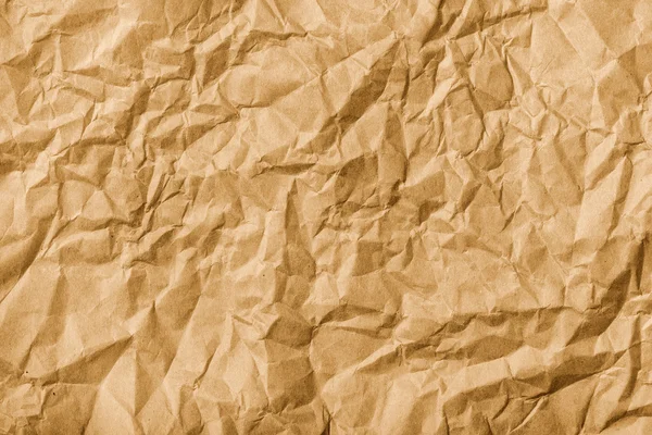 Crumpled brown kraft paper texture — Stock Photo, Image