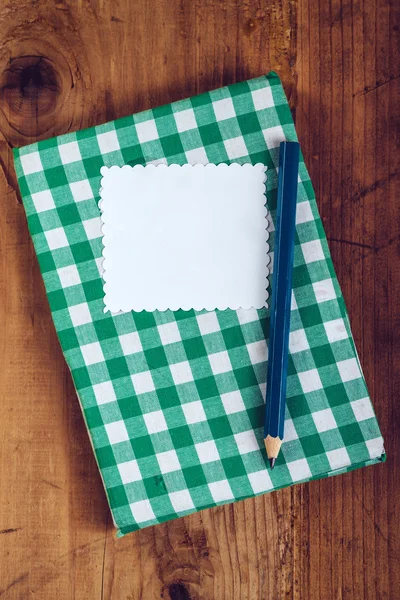 Handmade recipe cookbook on kitchen desk — Stock Photo, Image