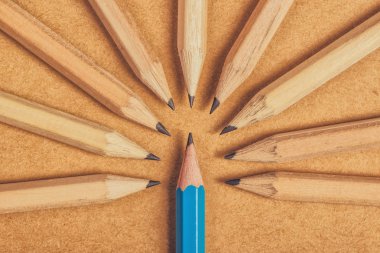 Being different concept with wood pencils on desk clipart