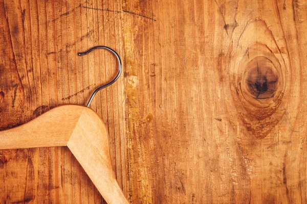 Retro cloth hanger on rustic wooden background, top view — ストック写真