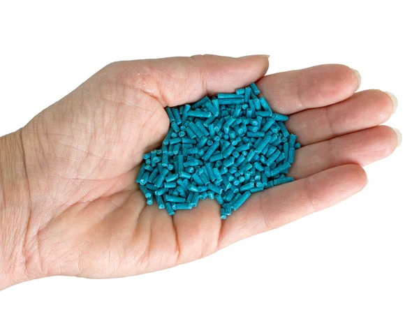 Slug killer pellets in hand, isolated over white — Stock Photo, Image