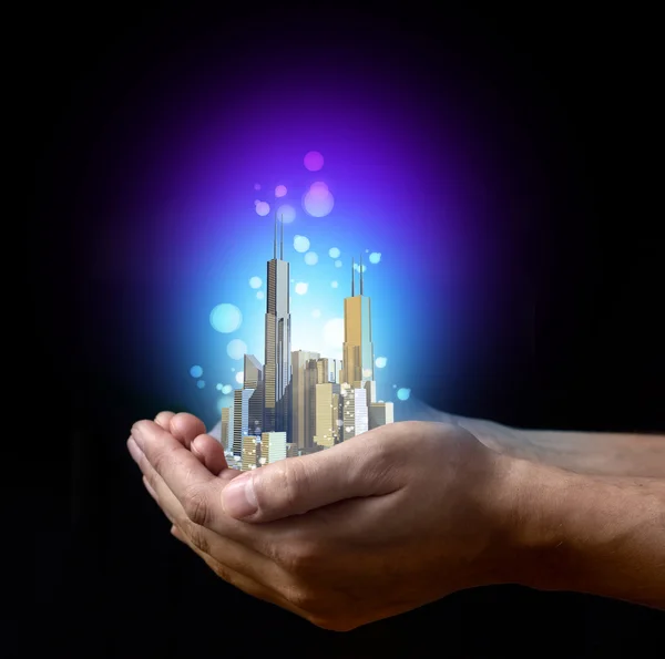 Metropolis in zakenman hand — Stockfoto