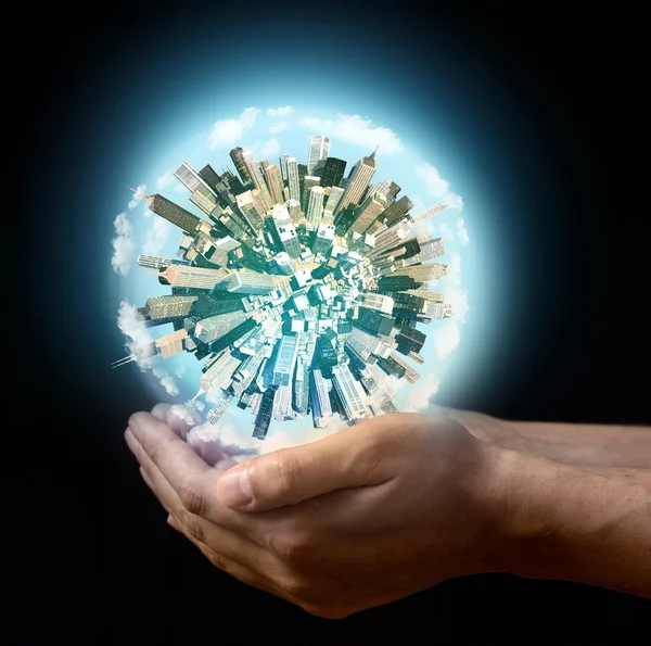 Miniature planet in the hands — Stock Photo, Image