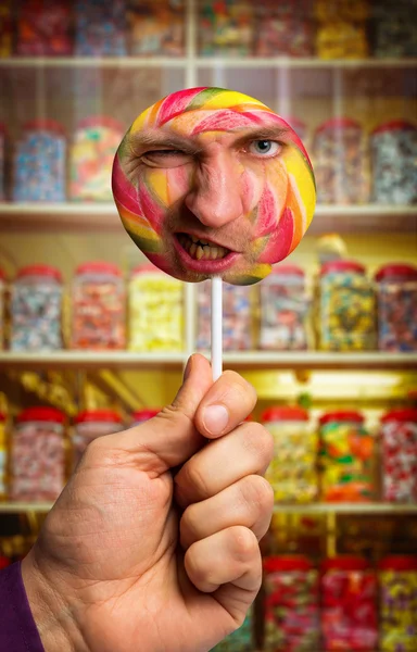 Lollipop med manliga ansikte — Stockfoto