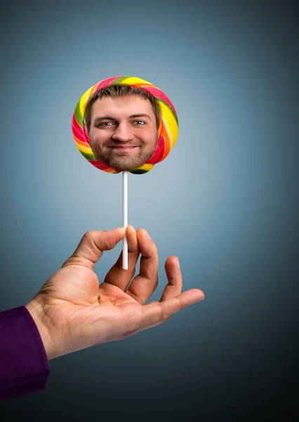 Lollipop med manliga ansikte — Stockfoto