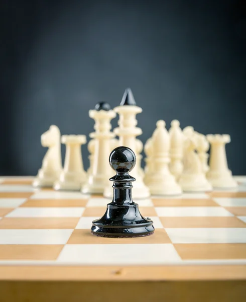 Black pawn standing — Stock Photo, Image