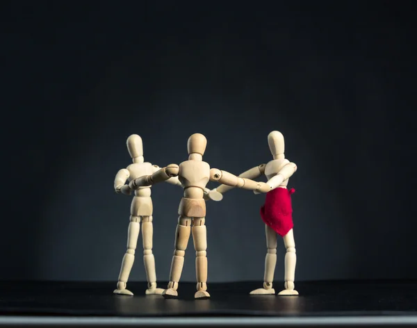 Family of wooden figures in circle — Stock Photo, Image