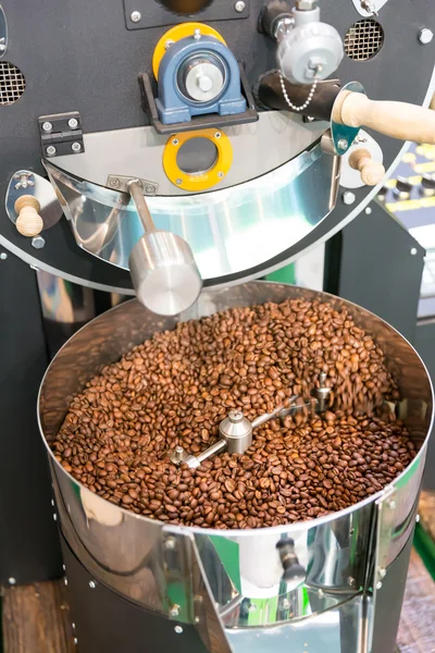 Coffee beans in machine — Stock Photo, Image