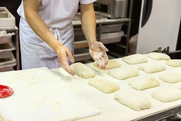 Baker working with dough — Stock Photo, Image