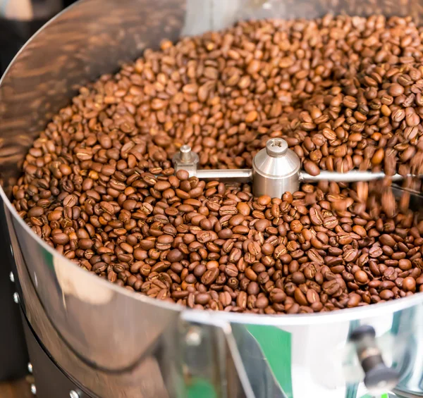Coffee beans in machine — Stock Photo, Image