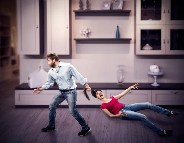 Man pulling woman by the hair — Stock Photo, Image