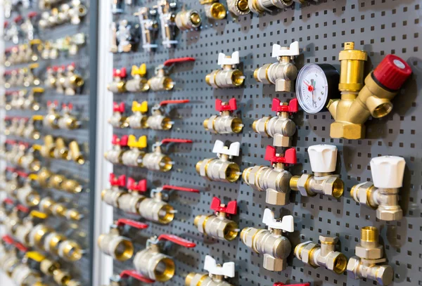 Different valves on the wall — Stock Photo, Image