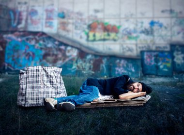 Homeless sleeping on cardboard clipart