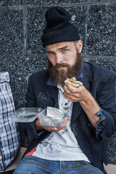 homeless is having his meal