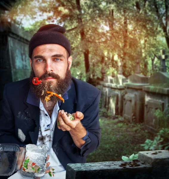 Desperate vagrant with food — Stock Photo, Image