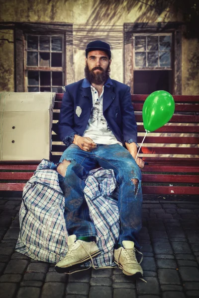 Bearded vagrant with balloon — Stock Photo, Image