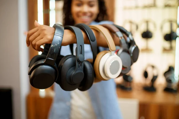 Woman Shows Headphones Collection Audio Components Store Female Person Music — Stock Photo, Image