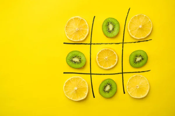 Vegan cross-zero game on yellow background — Stock Photo, Image