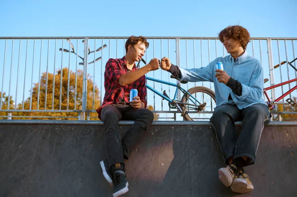 Young bmx bikers leisures on ramp in skatepark