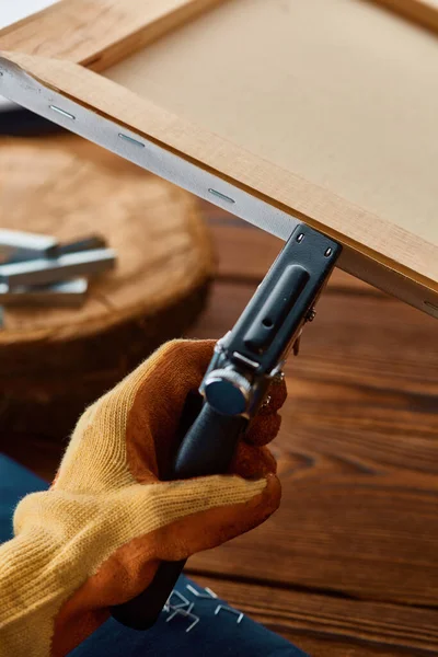 Male Hand Glove Holds Stapler Closeup Wooden Background Professional Instrument — Stock Photo, Image