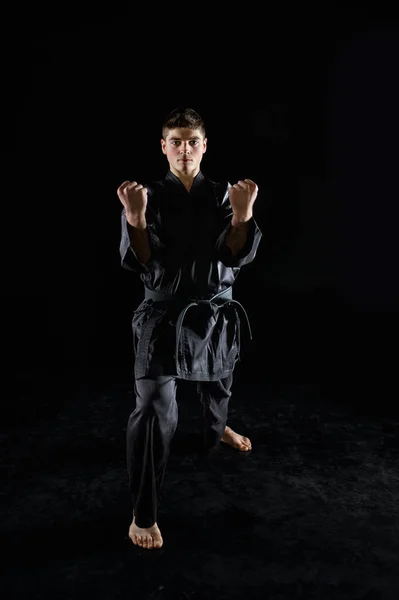 Male Karate Fighter Black Kimono Combat Stance Front View Dark — Stock Photo, Image