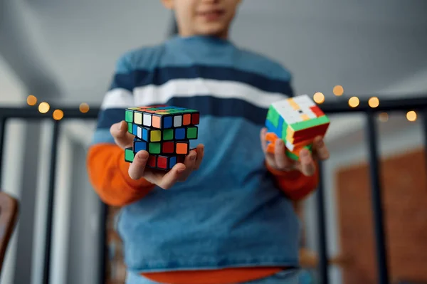 Male Kid Holds Puzzle Cube Selective Focus Hand Toy Brain — Stockfoto