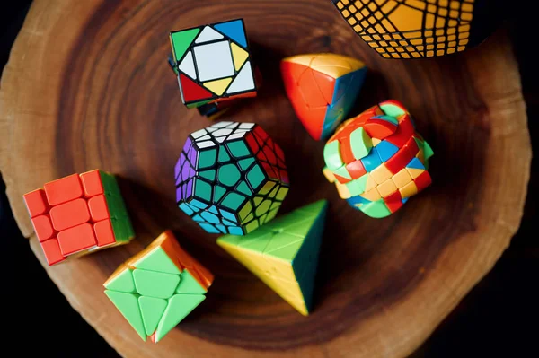 Different Colorful Puzzle Cubes Wooden Stump Top View Nobody Toy — Stock Photo, Image