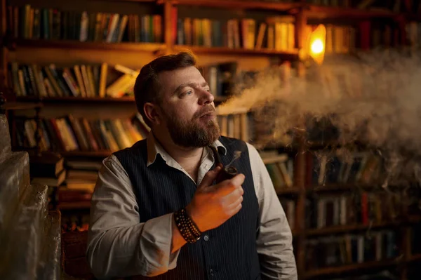 Serious Bearded Man Smokes Cigar Office Bookshelf Background Tobacco Smoking — Stock Photo, Image