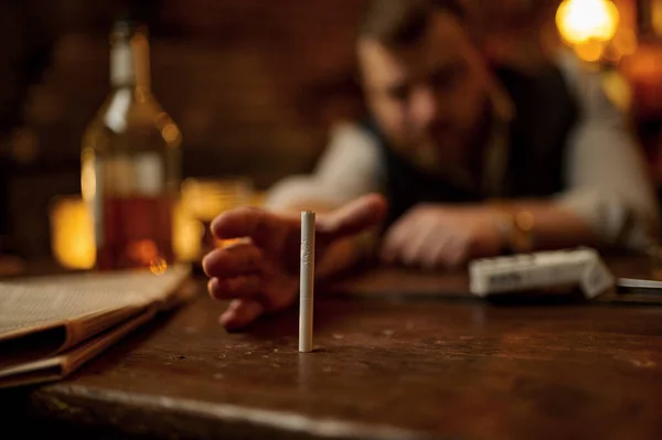 Drunk Man Tries Take Cigarette Alcohol Beverage Bottle Background Tobacco — Stock Photo, Image