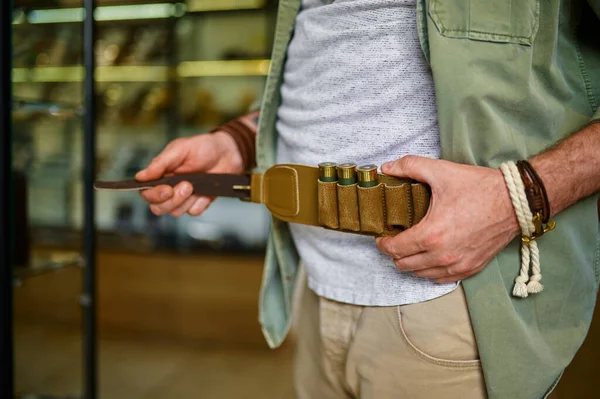 Bearded Male Hunter Buying Leather Bandolier Gun Store Weapon Shop — Stock Photo, Image