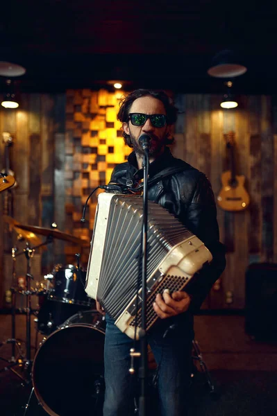 Brutal musician with accordion, music performing — Stock Photo, Image