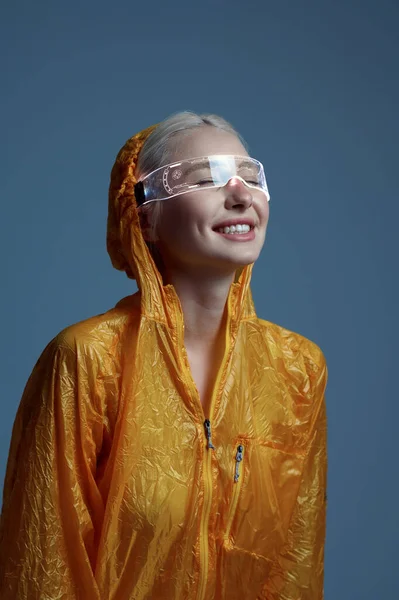 Futuristic woman in raincoat and modern glasses — Φωτογραφία Αρχείου