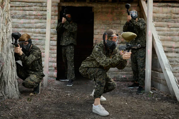 Paintball team fights on playground in the forest — Stock Photo, Image