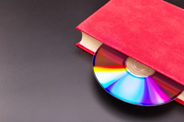 Disk in book — Stock Photo, Image