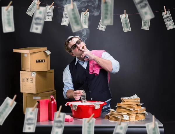 Businessman is laundering money in the basement — Stock Photo, Image