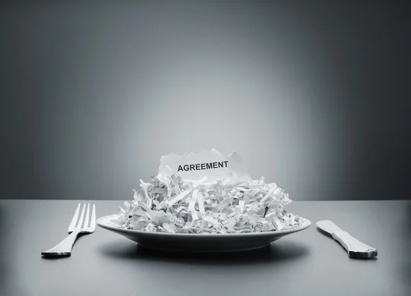 Shredded agreement on plate — Stock Photo, Image