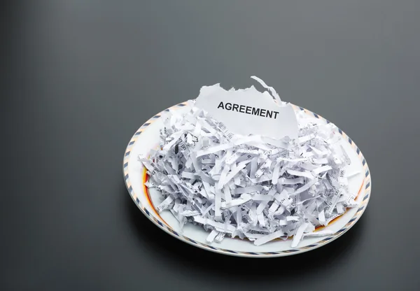 Heap of shredded papers on plate — Stock Photo, Image