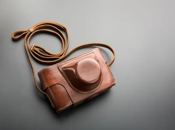 Vintage old film photo-camera in leather case — Stock Photo, Image