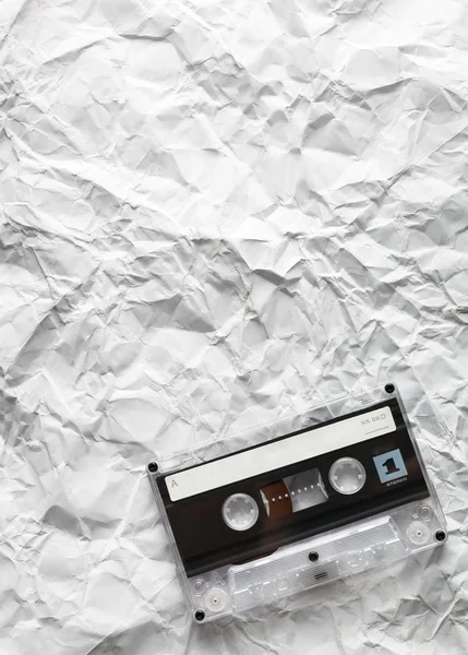 Audio cassette is lying on the paper — Stock Photo, Image